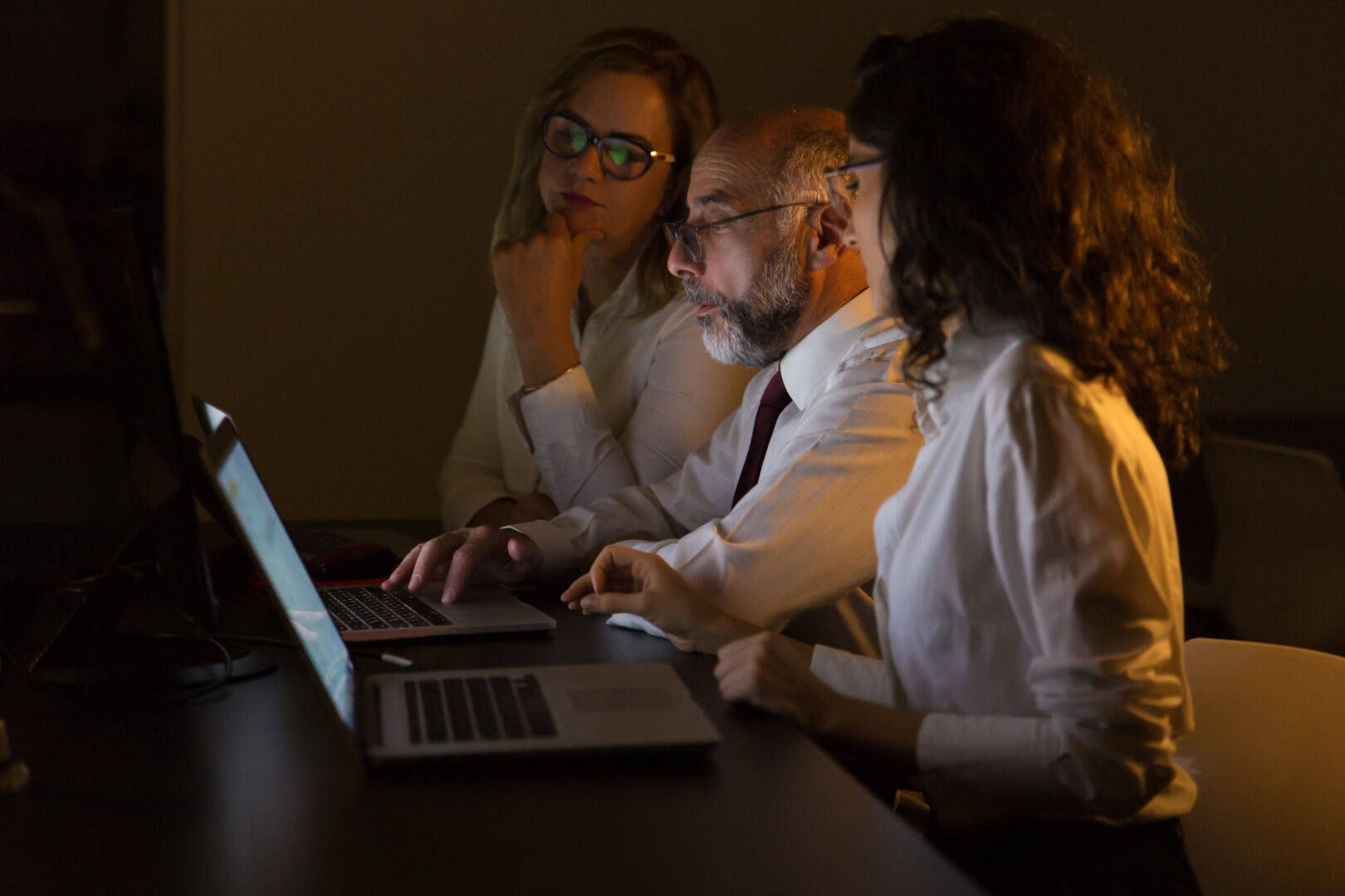 business-colleagues-using-laptops-at-night