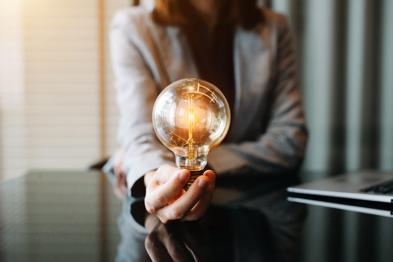 business-hand-showing-creative-business-strategy-with-light-bulb