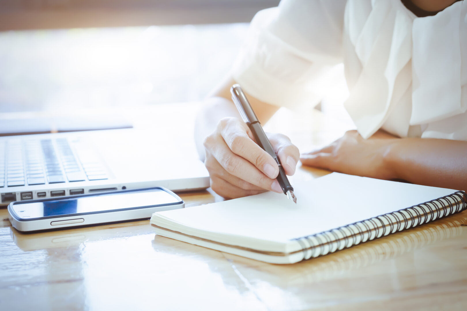 close-up-woman-taking-notes