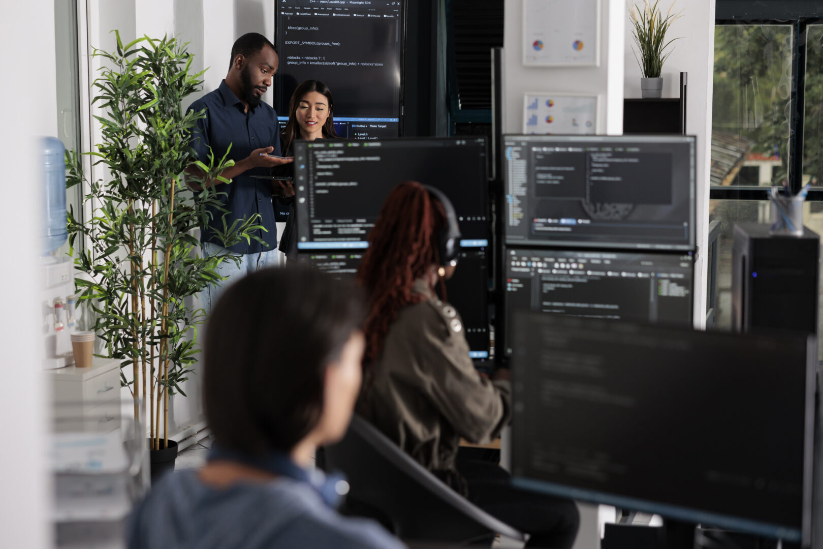software-programmers-discussing-about-algorithms-on-big-screen