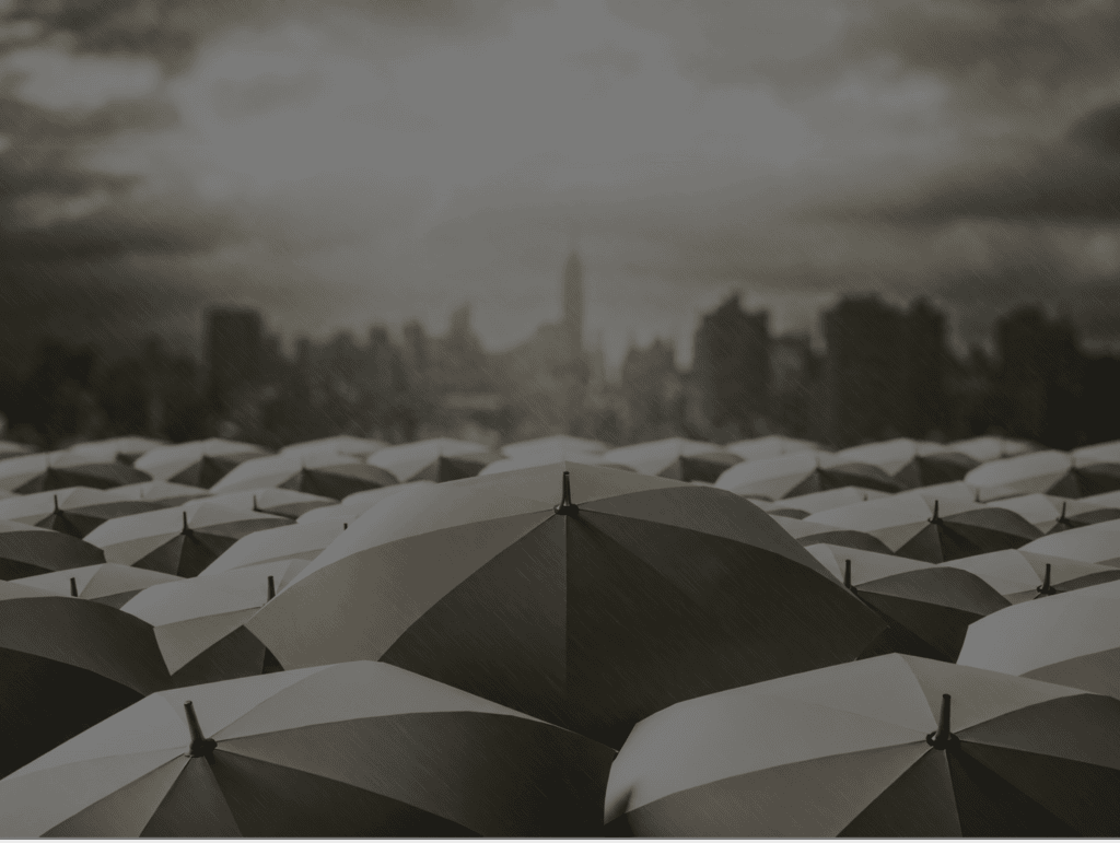 Overlapping umbrellas viewed from above, illustrating how reinsurance spreads risk in layers
